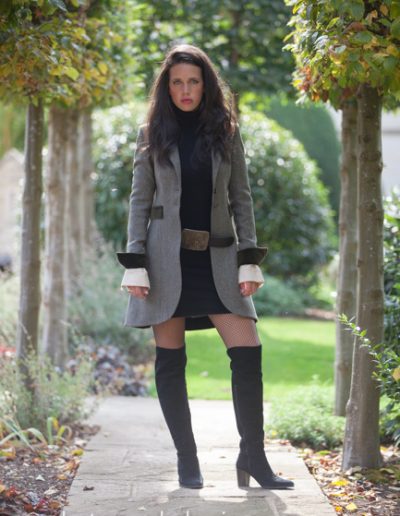 girl in long haired girl wearing long boots in the cotswolds